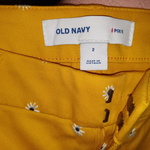 Old Navy Pixie yellow pants with white flower print. - Picture 5 of 5